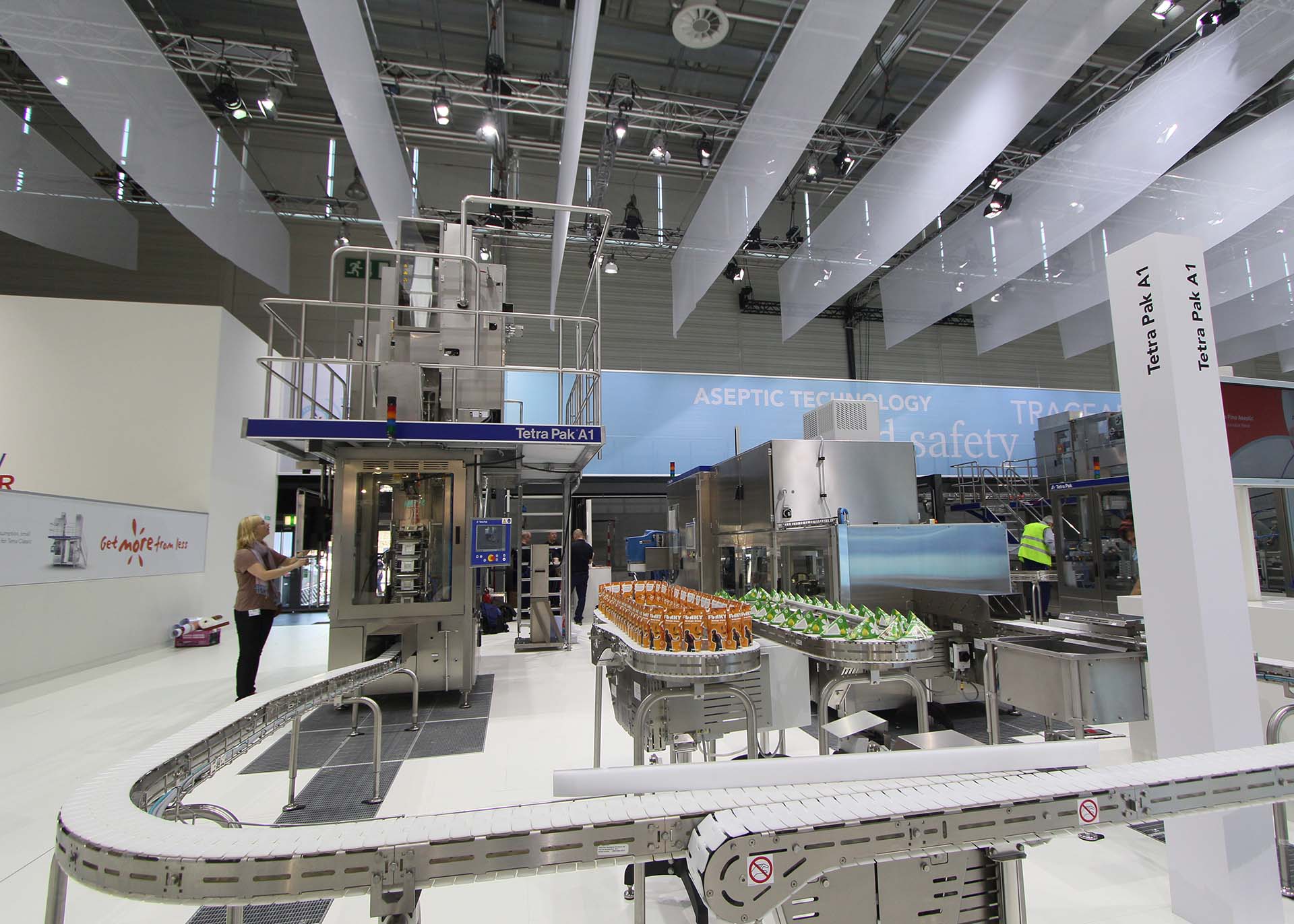 Exhibition display of Tetra Pak A1 aseptic packaging machine at a trade show.